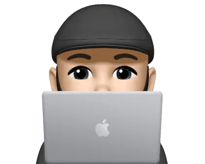 Osama Eldrieny peeking over a laptop